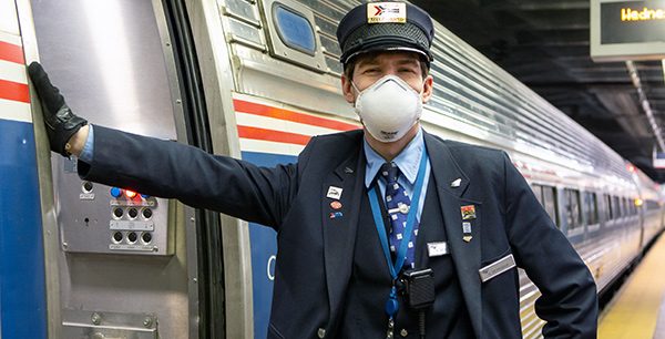 Amtrak employee wearing their face mask