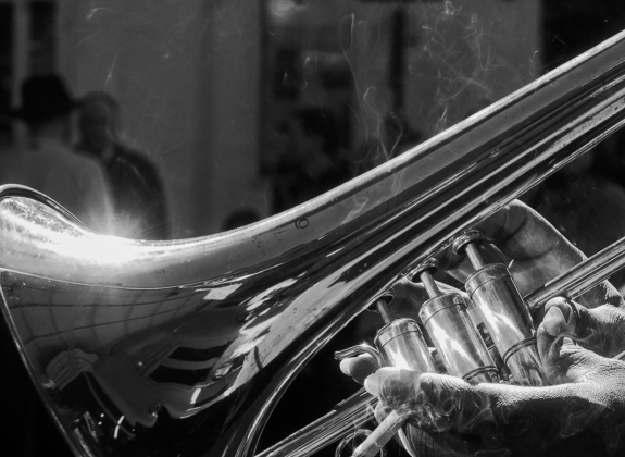 brass instrument being played in new orleans jazz club