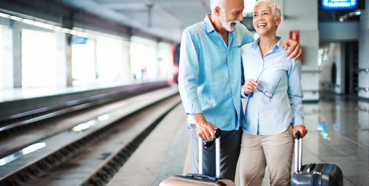 Couple with luggage at train station