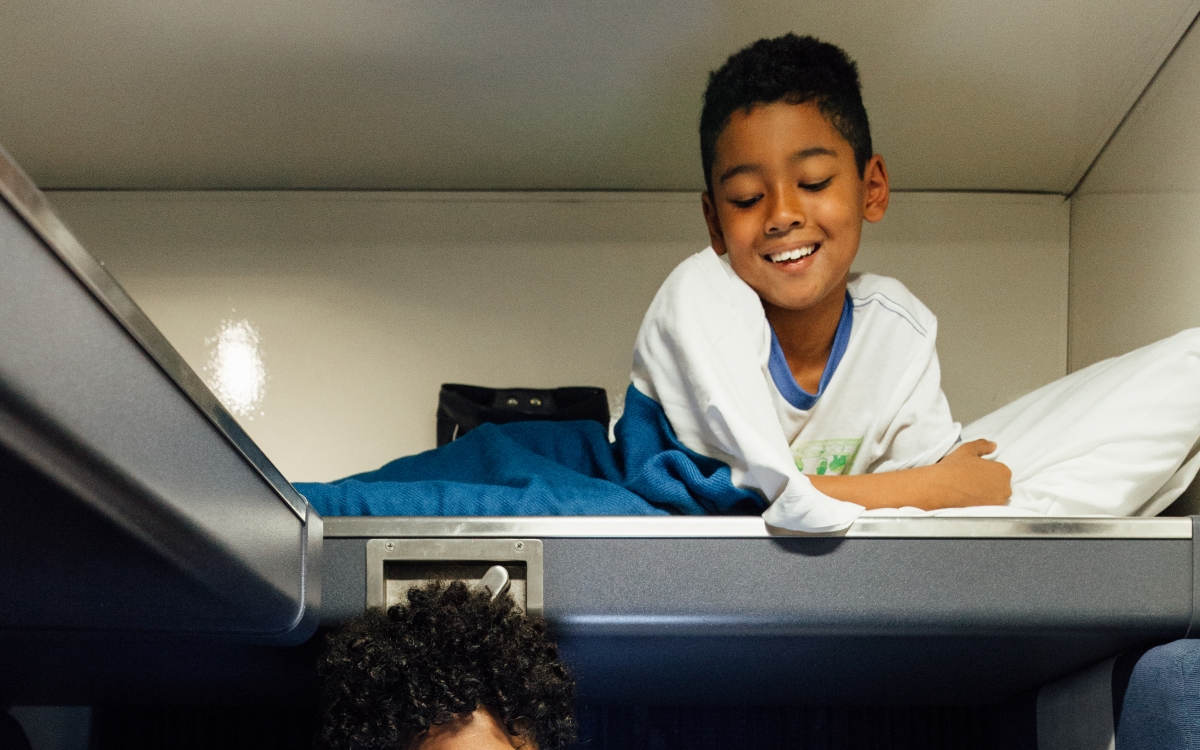mom and son in amtrak private family bedroom