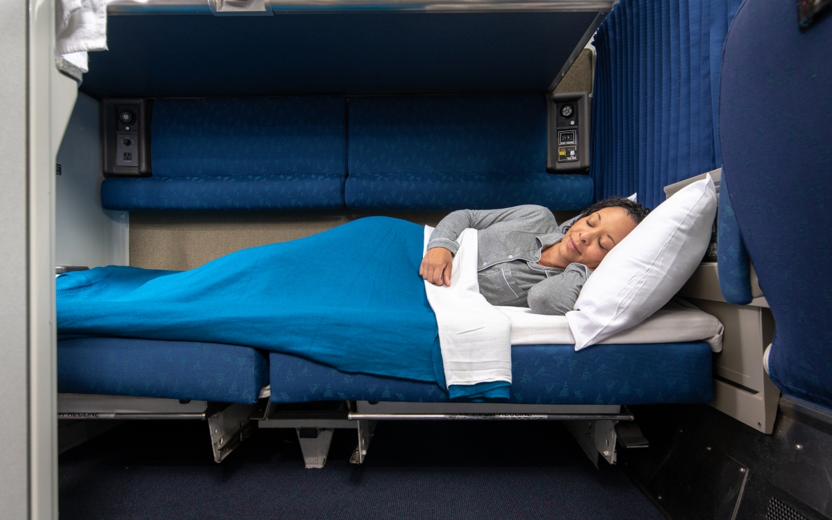 woman laying down in amtrak bedroom