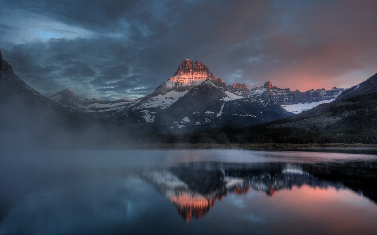 Swiftcurrent Lake Misty Dawn From The Balcony of The Many Glacier Hotel, Glacier National Park, Montana, USA