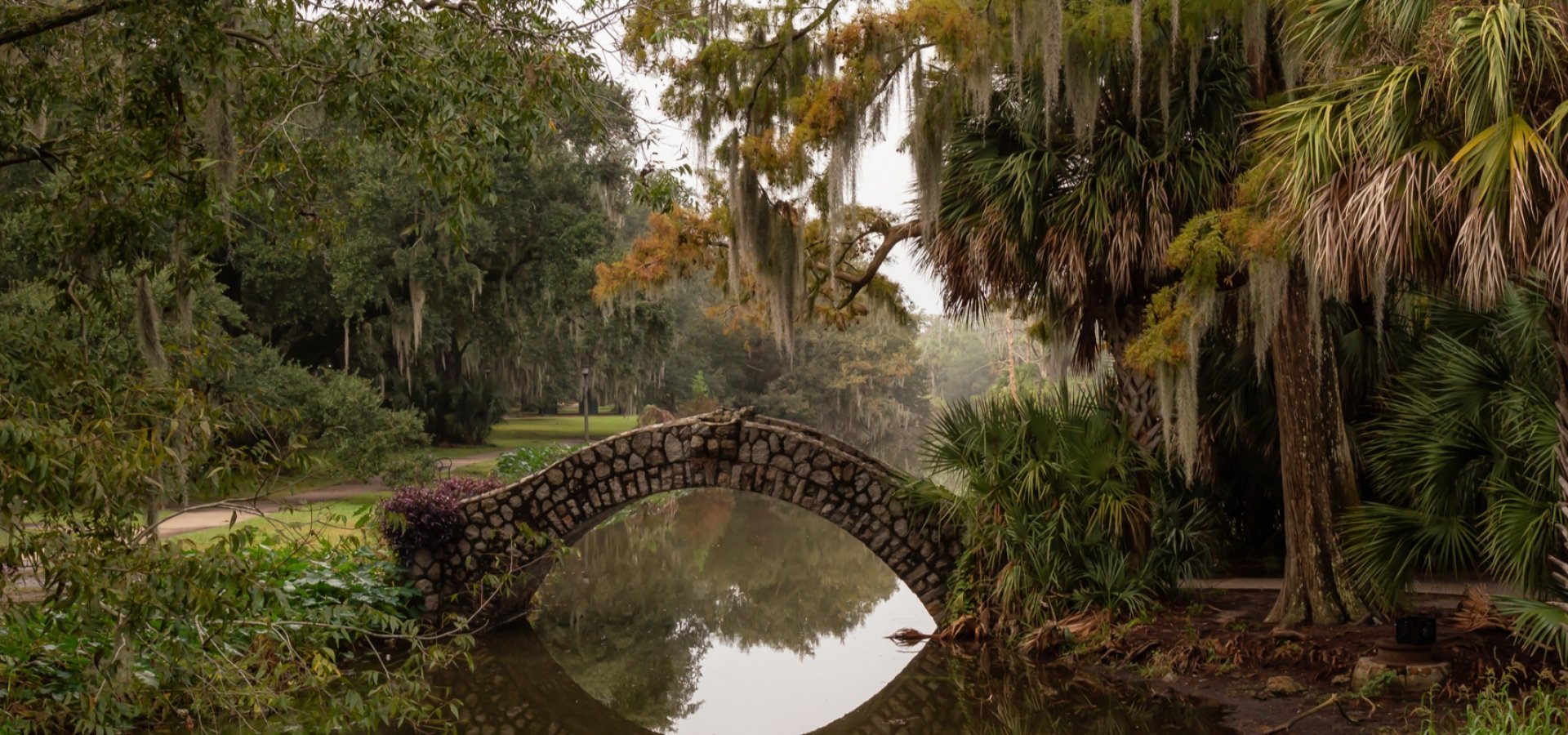 Bridge over a river duing a foggy morning. Taken in City Park, New Orleans, Louisiana, United States.