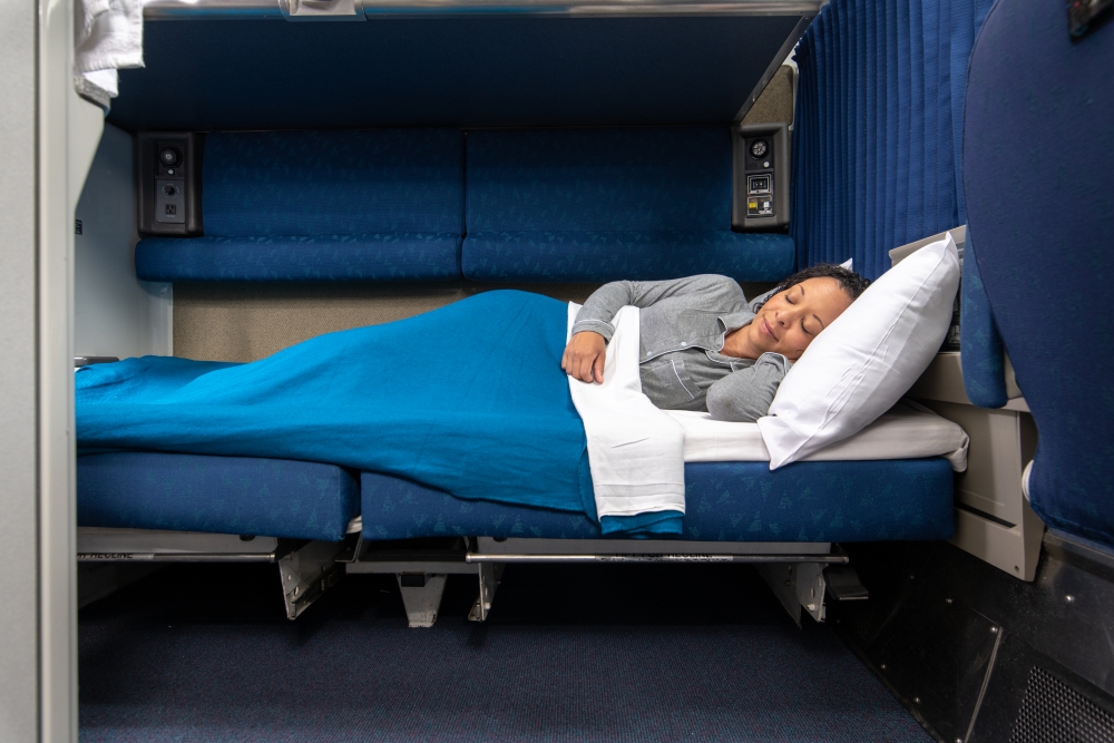 woman laying down in amtrak bedroom