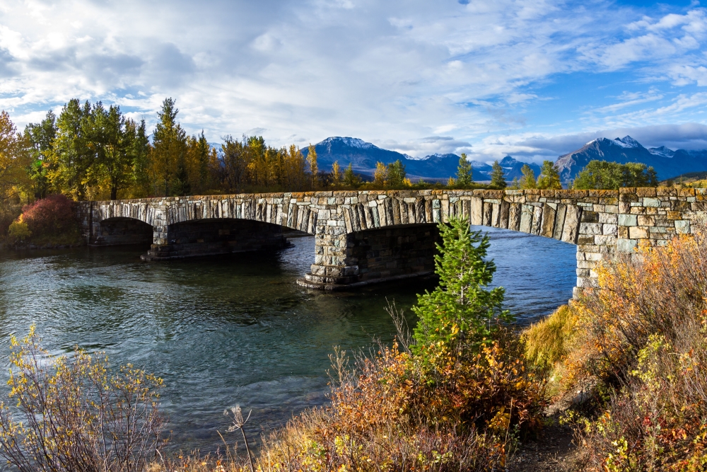 stone bridge at entrance of Glacier National Park in Montana